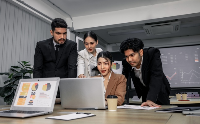 Financial advisors collaborate to assess a company's financial performance